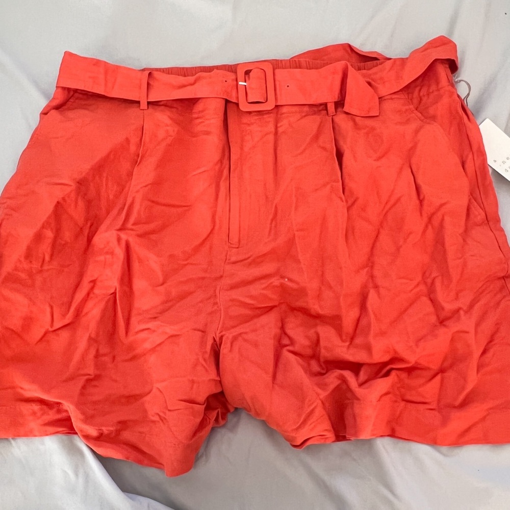 orange belted shorts